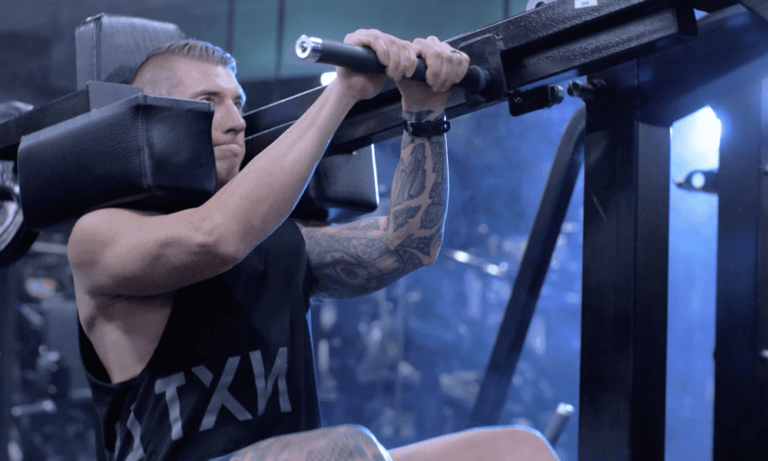 A gym member on some exercise equipment